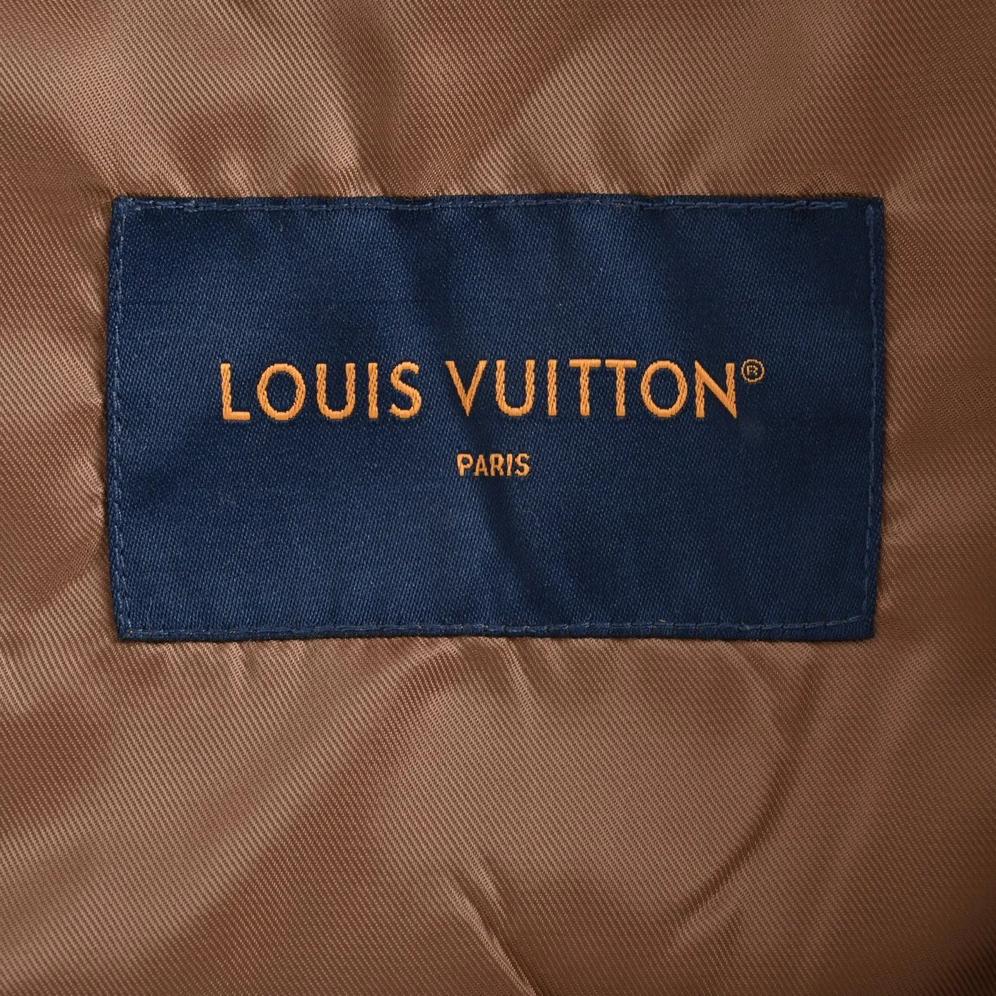 Louis Vuitton jacket with embroidered badges and all-over monogram print.